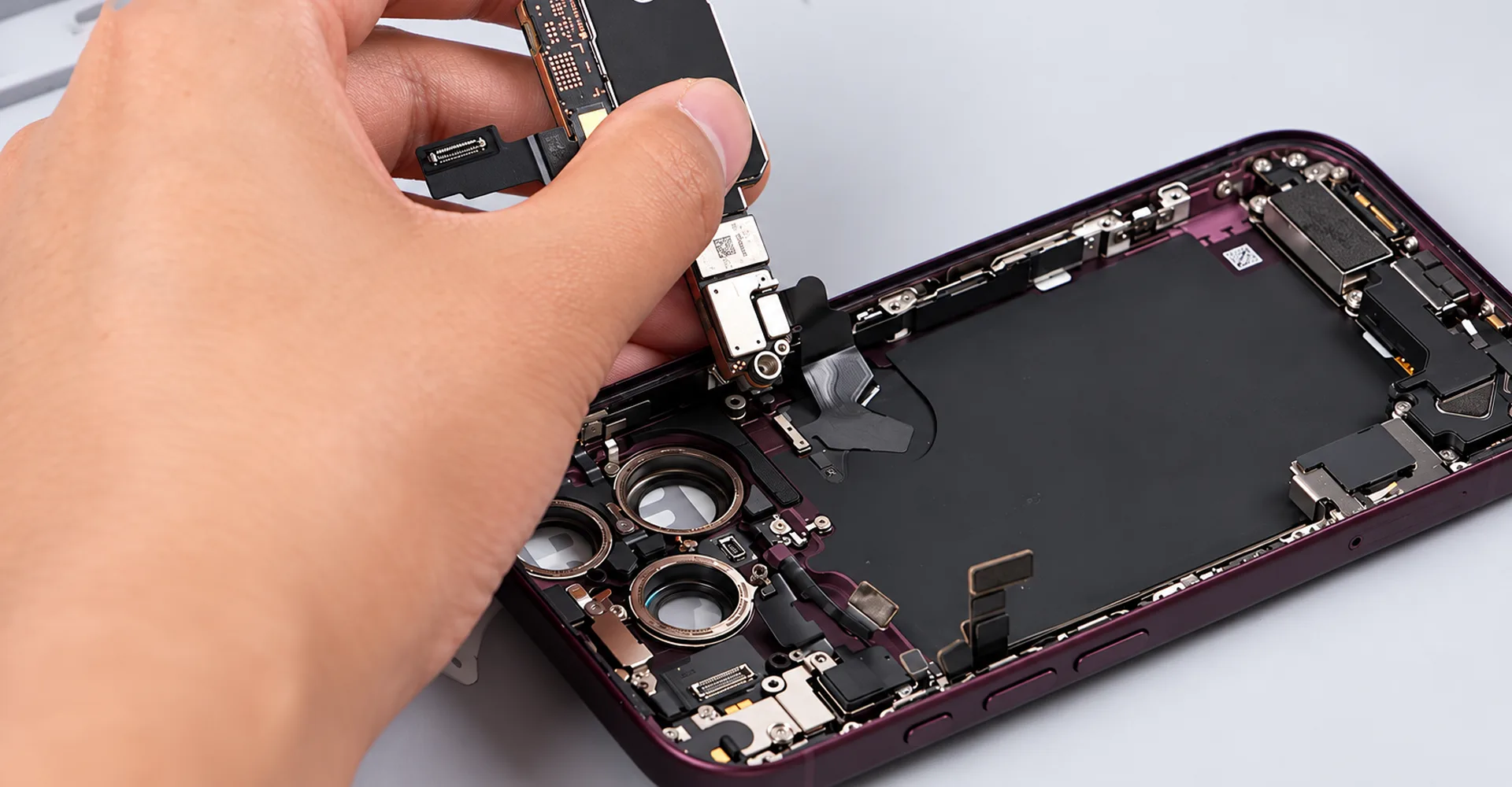 The wireless charging connection is handled before complete board removal